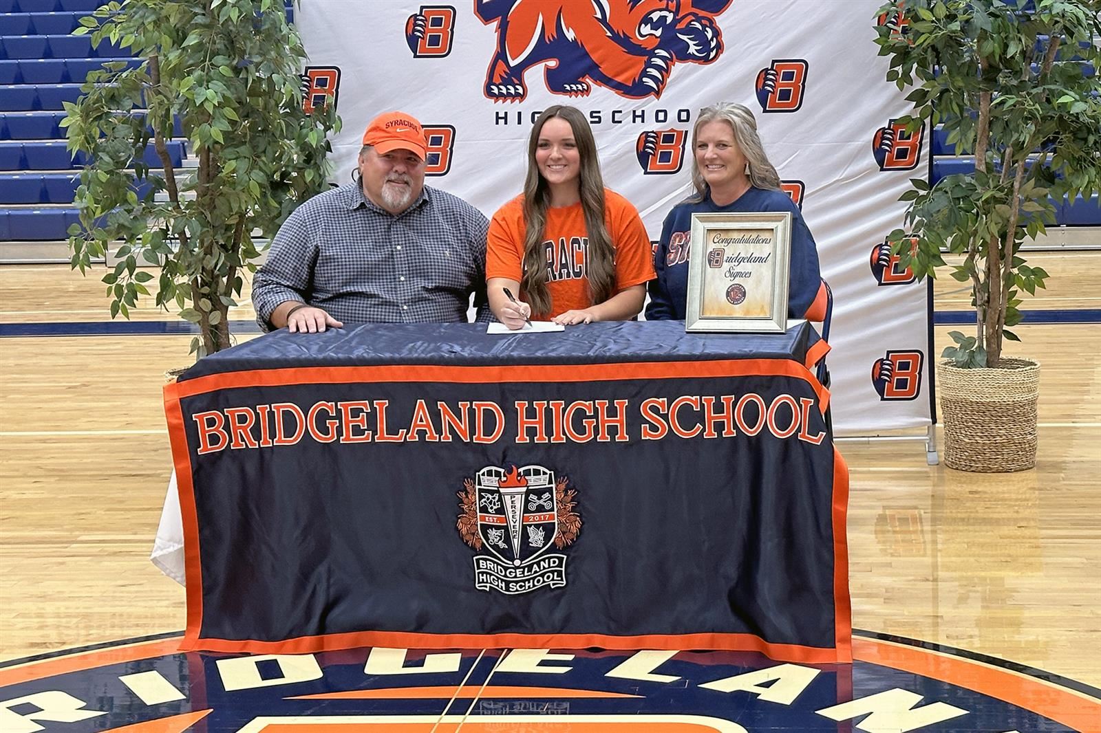Bridgeland High School senior Sydney Jackson, center, signed her letter of intent to play softball at Syracuse University.